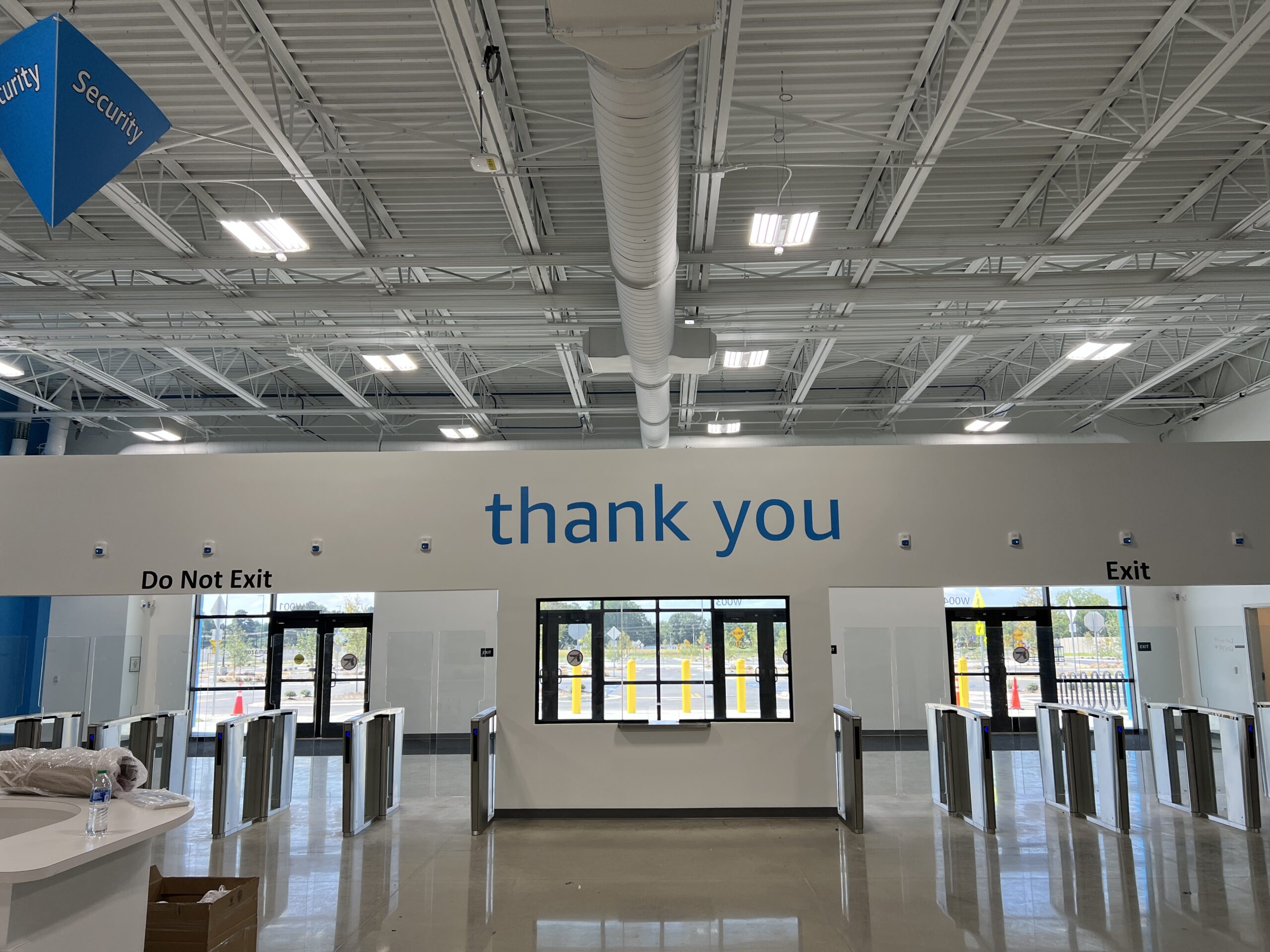 Interior of an Amazon fulfillment center, complete with vinyl wall graphics and interior branding by Identiti.