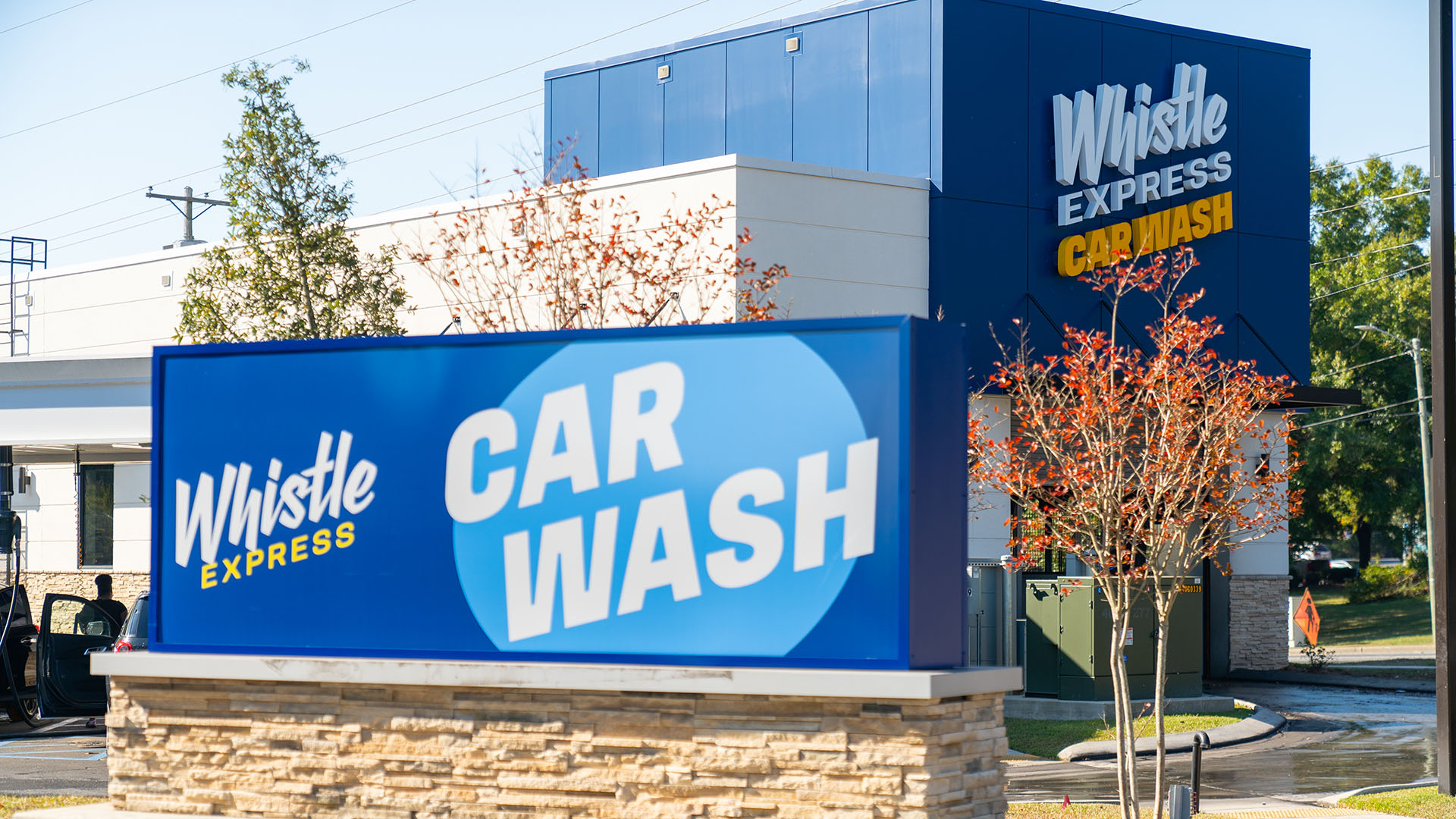 Exterior monument and building signage by Identiti for Whistle Express Car Wash.