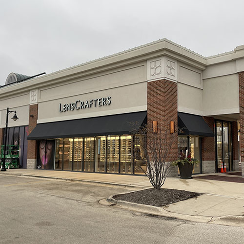 A LenscCrafters location featuring new signage and awnings by Identiti.
