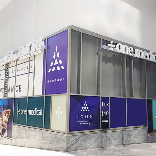 Exterior view of a One Medical location featuring signage and window graphics by Identiti.
