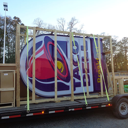 A crated Taco Bell sign, manufactured by Identiti, prepared for nationwide rollout.