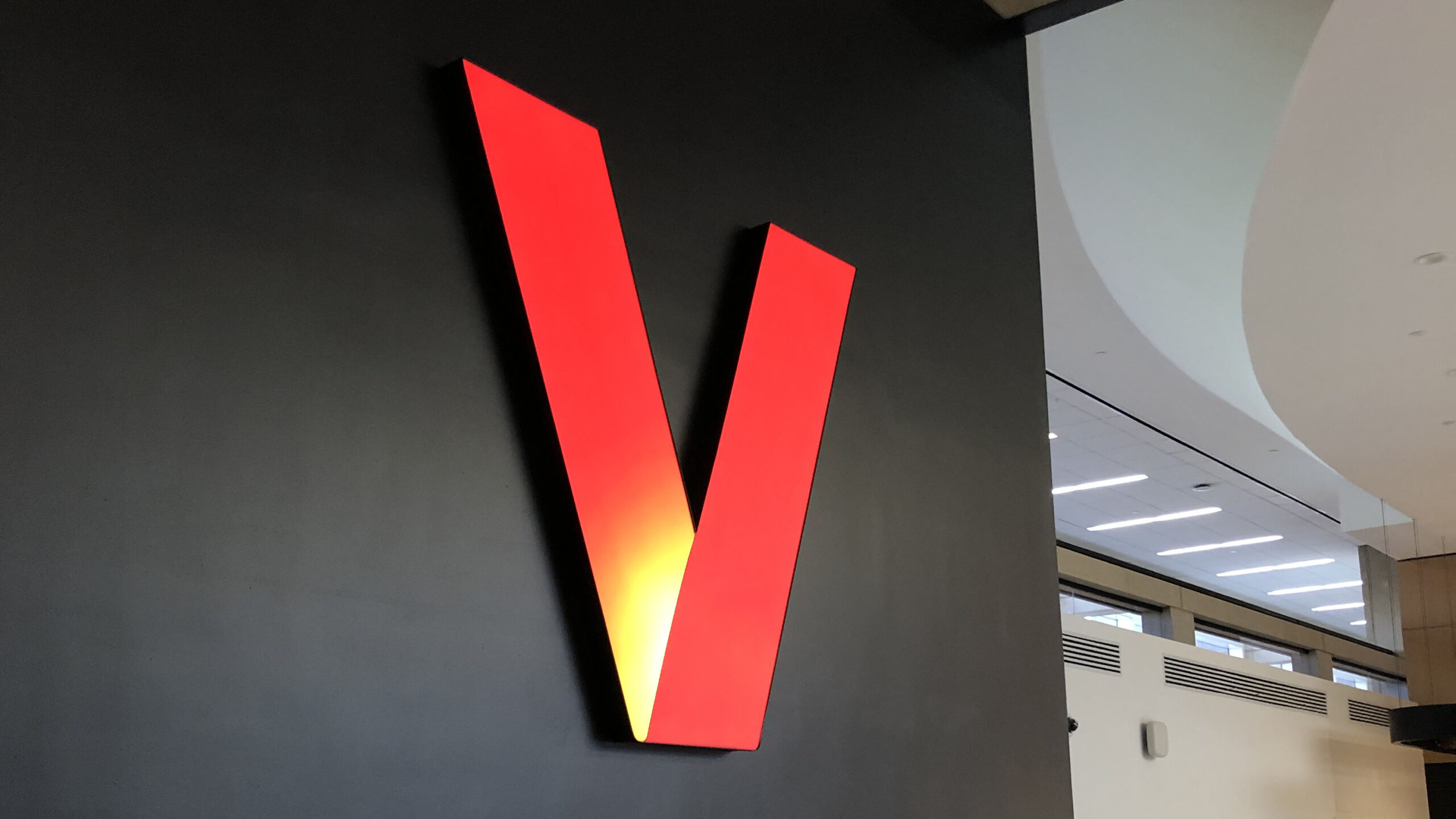 Custom interior illuminated signage for a Verizon corporate location, by Identiti.