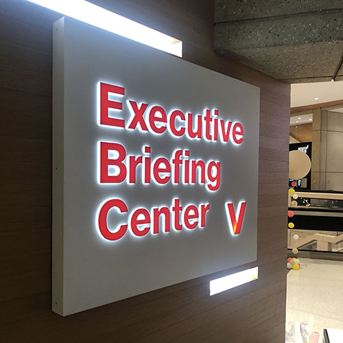 A custom, illuminated sign by Identiti, made for Verizon's Executive Briefing Center.