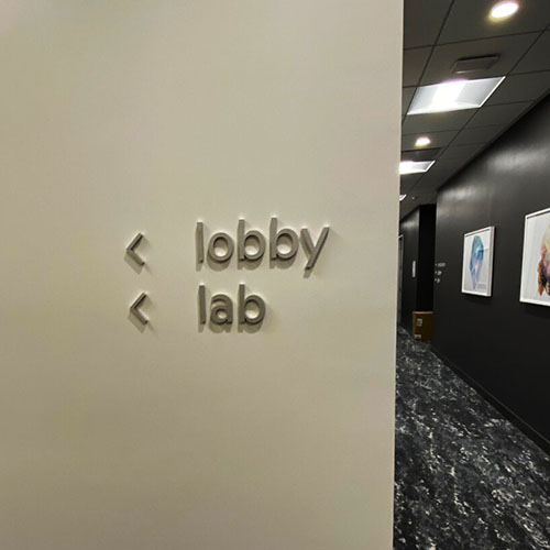 Custom wayfinding signage for One Medical, by Identiti.