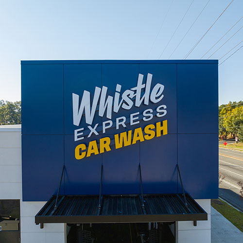Exterior signage for Whistle Express Car Wash, by Identiti.