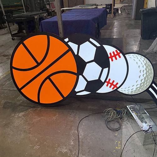 Various materials and finishes applied to a Dick's Sporting Goods prototype sign.