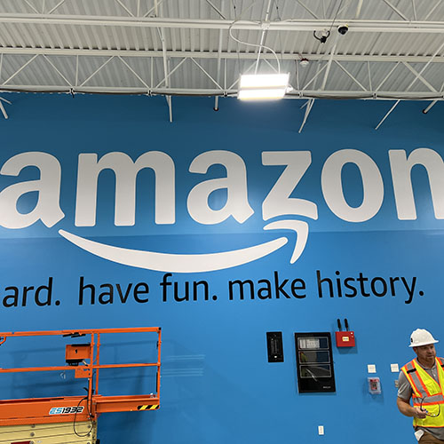 Interior branding for an Amazon facility, created and installed by Identiti.