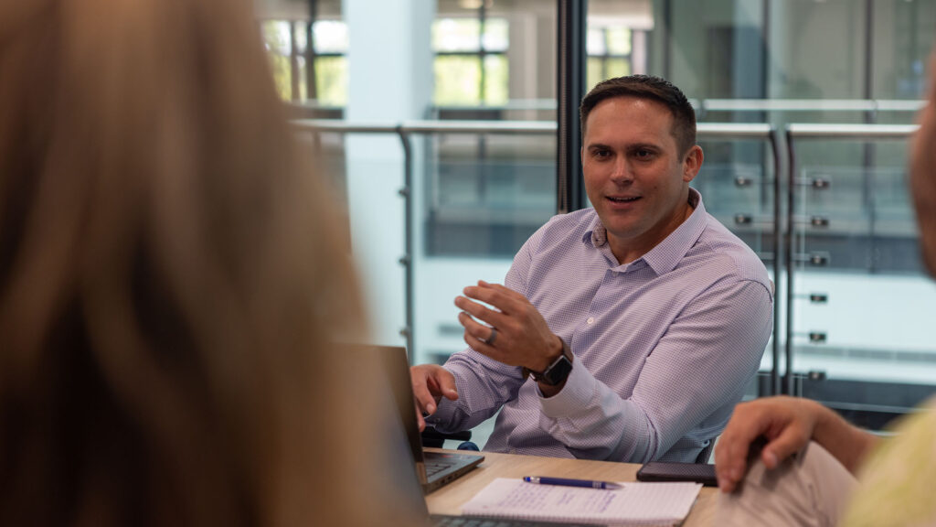 An Identiti team member in a conference room.