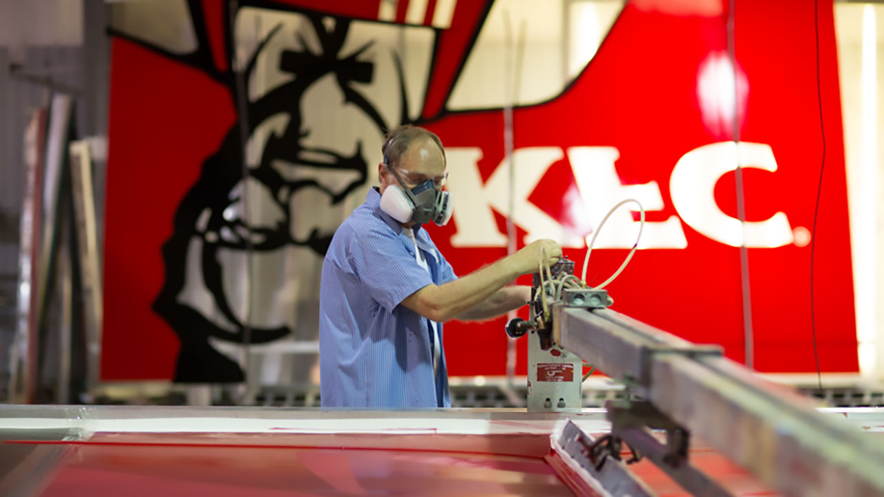 An Identiti manufacturer creating large signage faces for KFC.